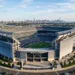 MetLife Stadium exterior in East Rutherford New Jersey with New York City skyline visible in distance